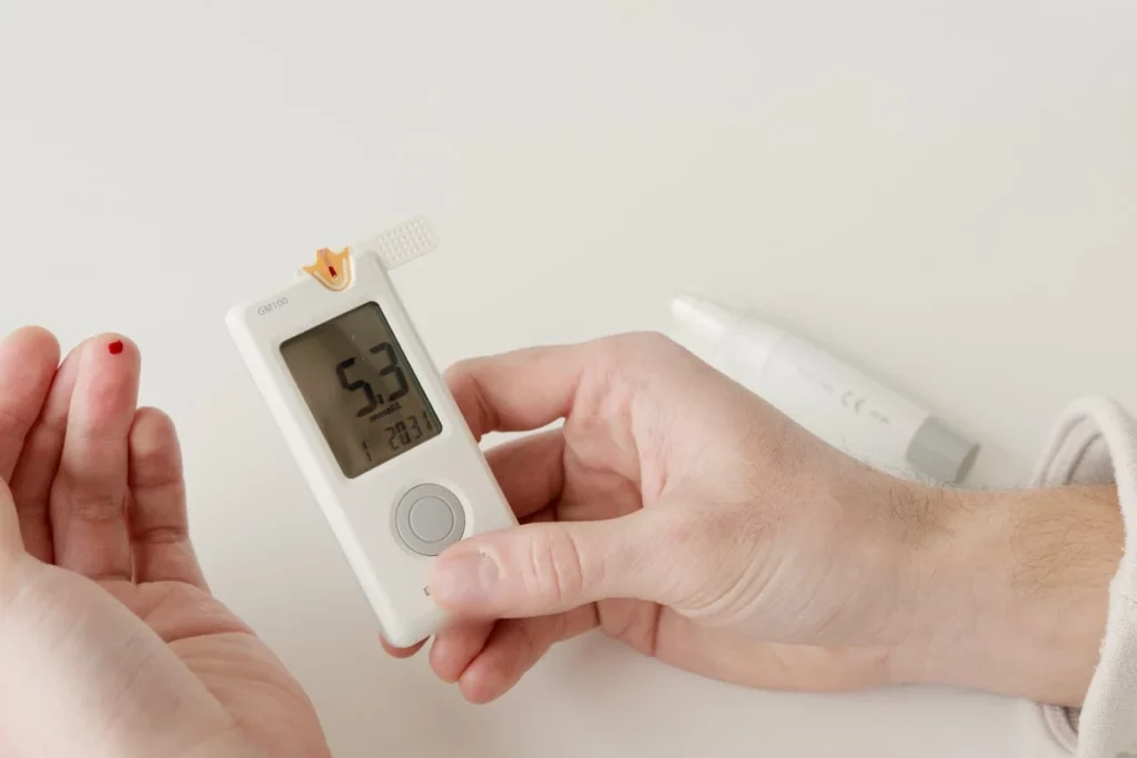 Patient receiving compassionate diabetes care at a modern medical clinic in Fulshear, TX, with a healthcare provider reviewing treatment plans and discussing healthy lifestyle choices.