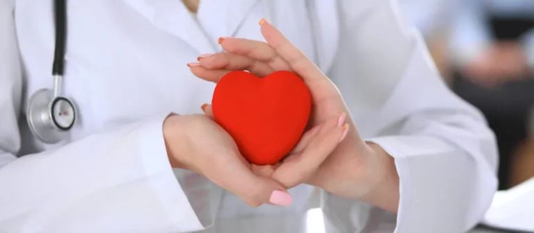 Medical professional providing compassionate heart attack care to a patient in Katy, Texas, with advanced diagnostic equipment in a modern clinical setting.