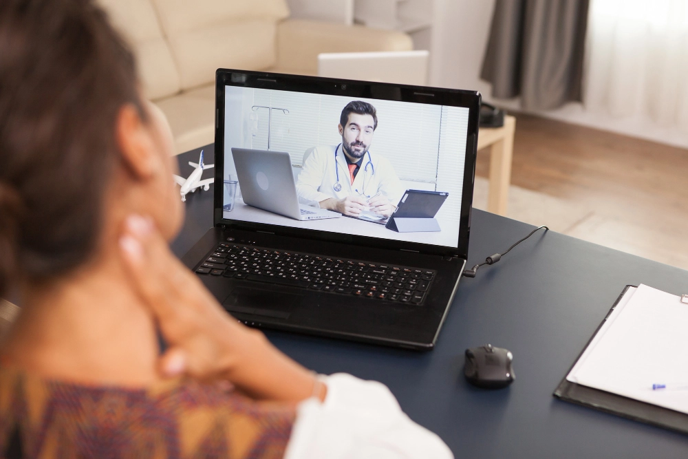 Doctor conducting a virtual telemedicine consultation for patients in Katy, TX.